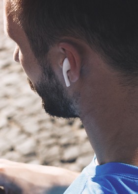 a man wearing wireless earbuds